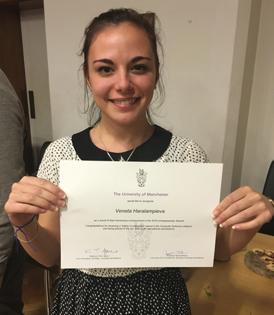 Venta holding her certificate